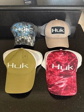 Bundle of (4) Huk fishing caps.